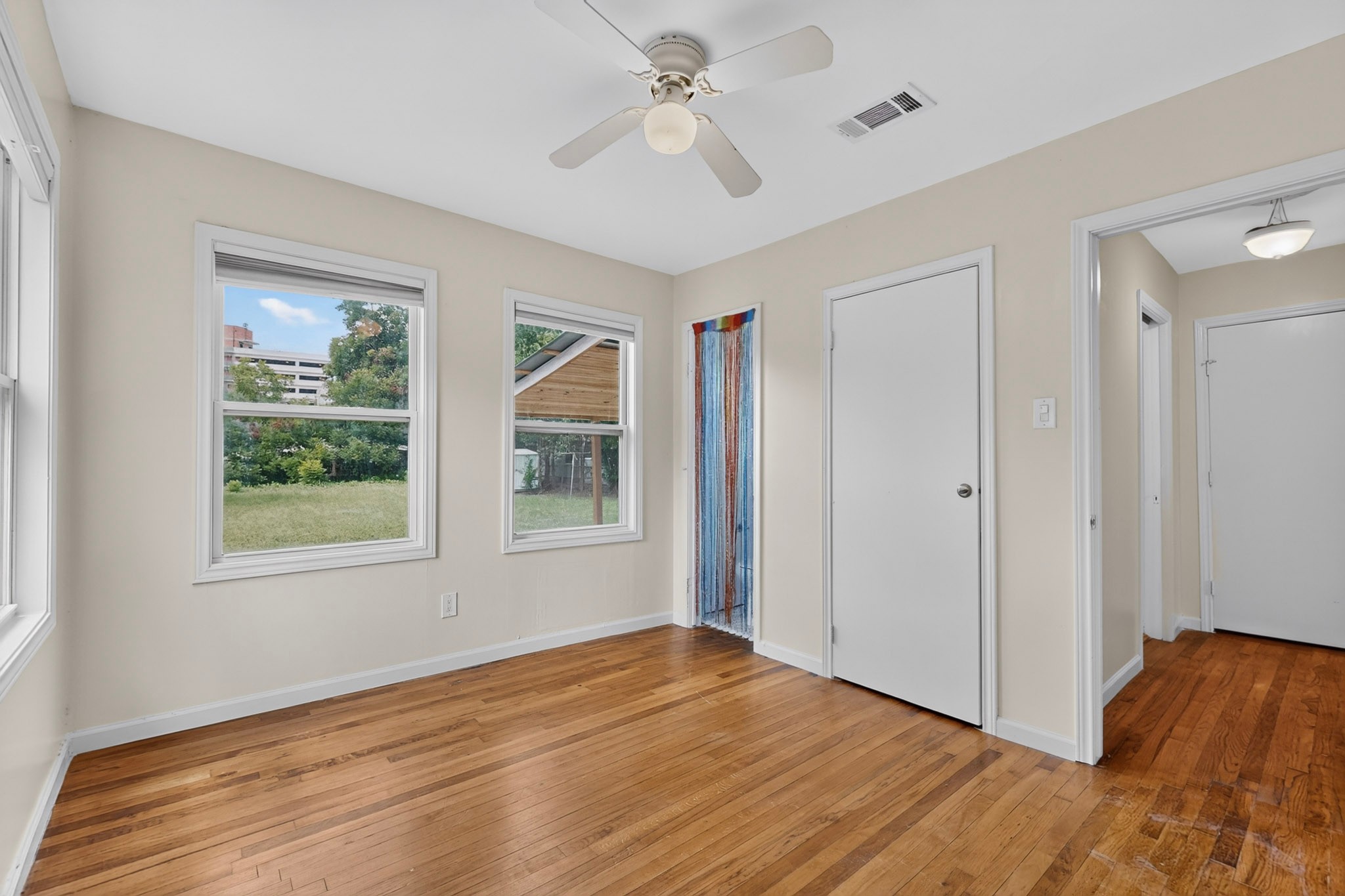 4711 Alf Avenue Austin, TX 78721 - Photo 25 of 34 BR2 - Hardwood flooring, multiple windows for abundant natural light, and a half bath