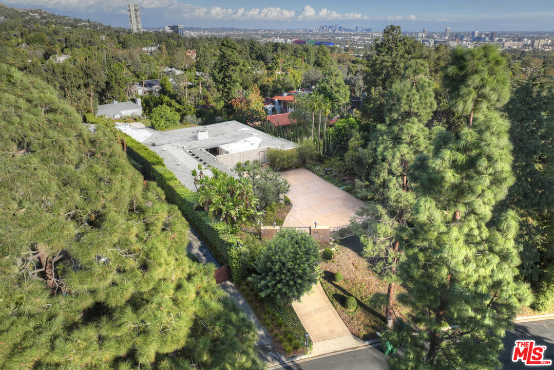 938 North Alpine Drive Beverly Hills, CA 90210 - Photo 1 of 11 an aerial view of a house with a yard