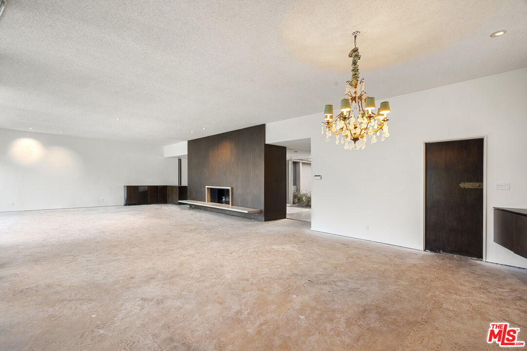 938 North Alpine Drive Beverly Hills, CA 90210 - Photo 7 of 11 a view of a chandelier in big room and chandelier