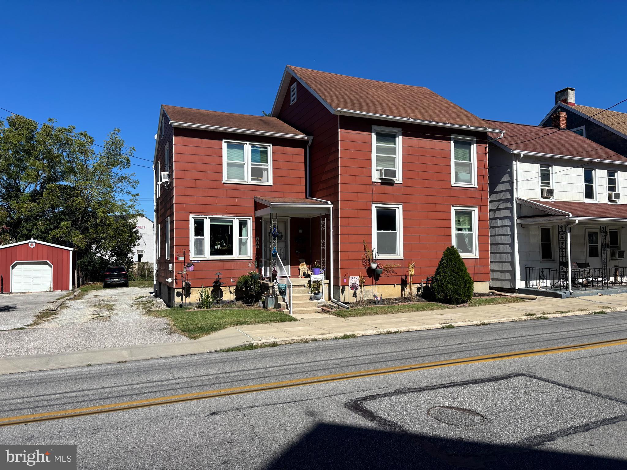 219 North 3rd Street Hanover, PA 17331 - Photo 1 of 12 a view of a brick house with a swimming pool in front of it