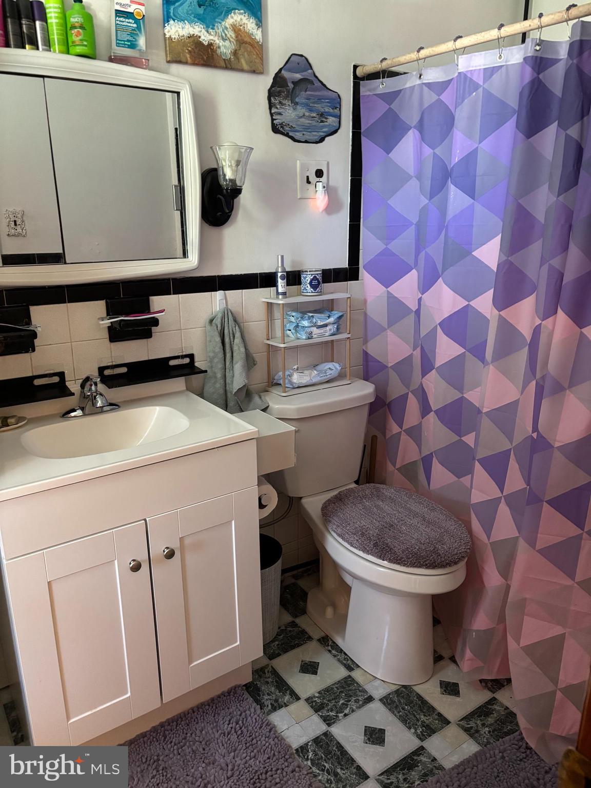 219 North 3rd Street Hanover, PA 17331 - Photo 12 of 12 a bathroom with a granite countertop toilet sink and mirror