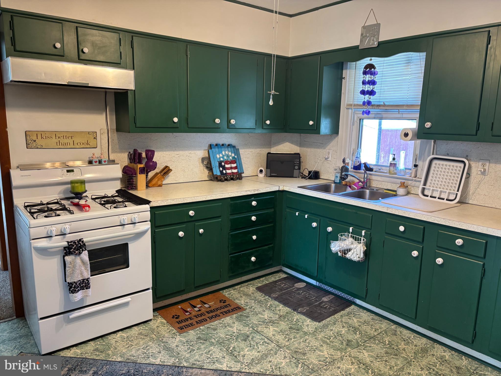 219 North 3rd Street Hanover, PA 17331 - Photo 10 of 12 a kitchen with a cabinets and a stove