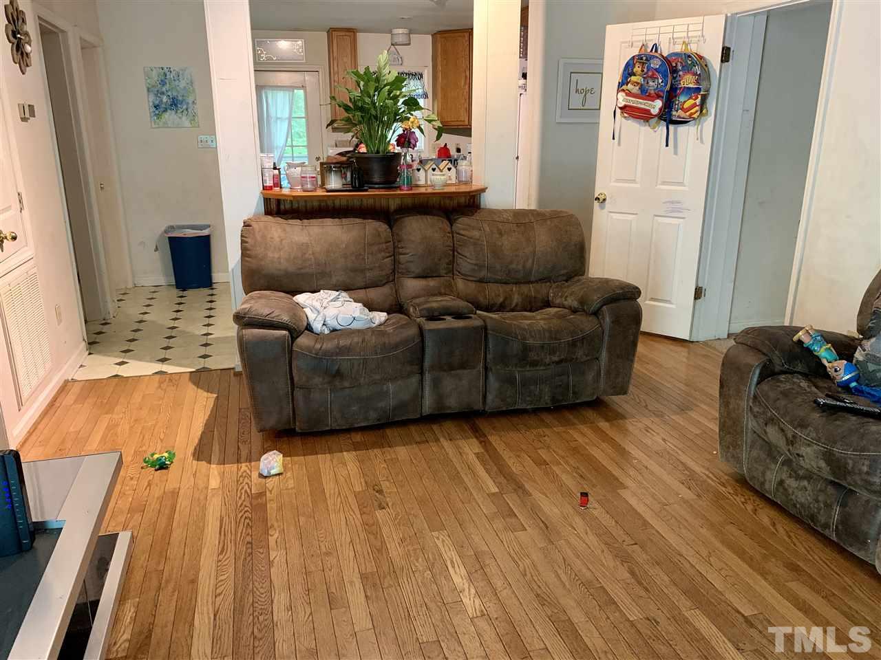 5121 Vann Street Raleigh, NC 27606 - Photo 2 of 12 a living room with furniture and a couch