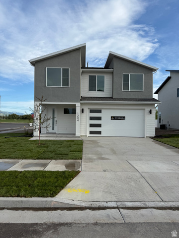 1204 West 575 South Logan, UT 84321 - Photo 2 of 23 Contemporary two-story residence featuring a gray and white exterior with a contrasting angled roofline