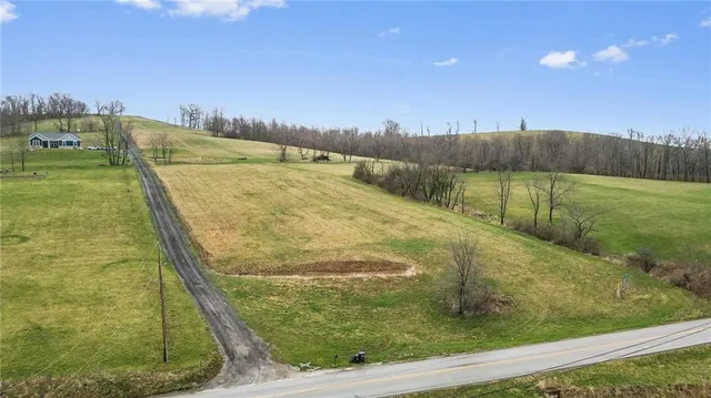 a view of a swimming pool with a yard