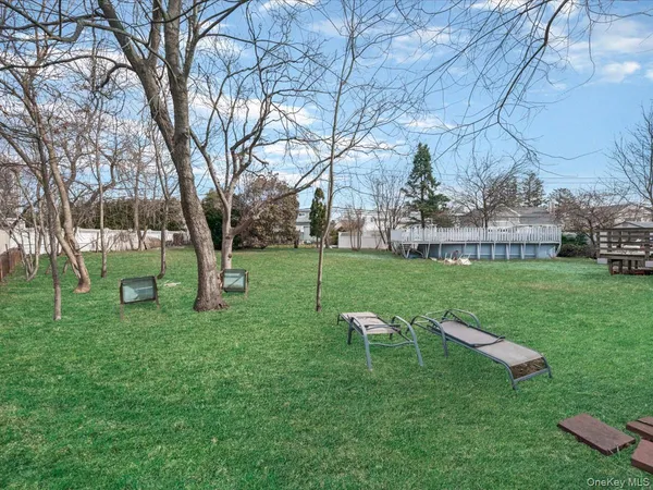 a view of backyard with sitting area