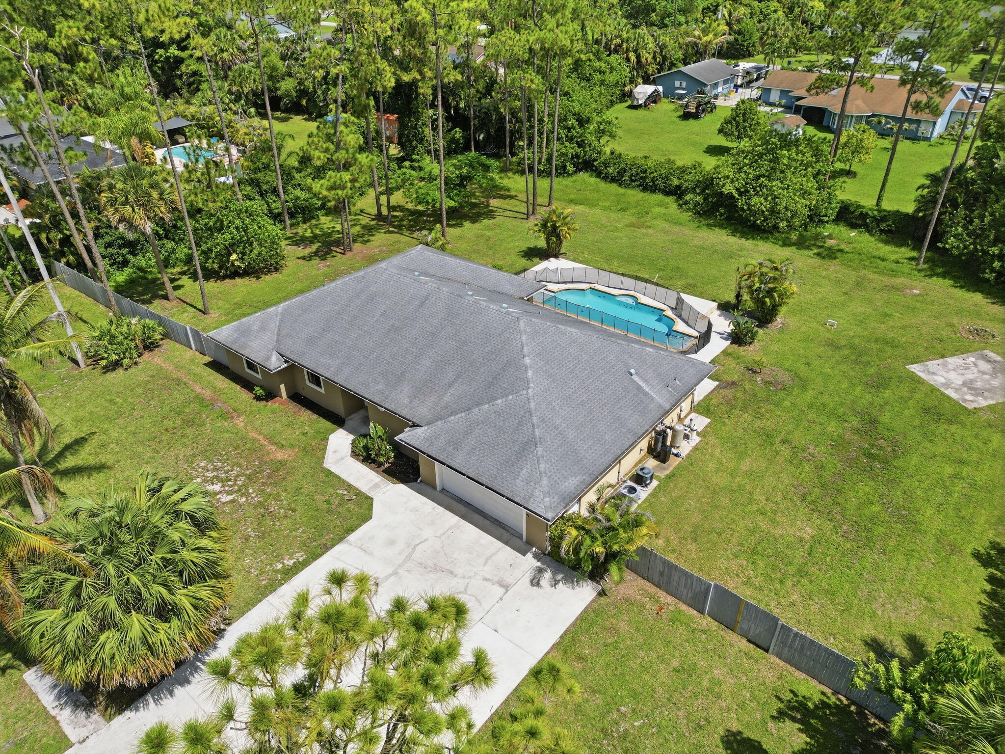 15731 85th Road North Loxahatchee, FL 33470 - Photo 49 of 65 an aerial view of a house with a yard basket ball court and outdoor seating