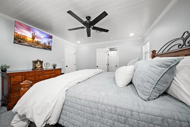 a bathroom with a granite countertop sink a toilet and shower
