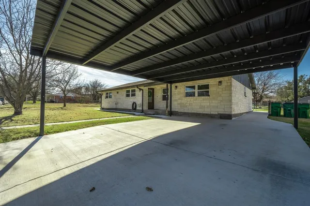 a view of a backyard of the house