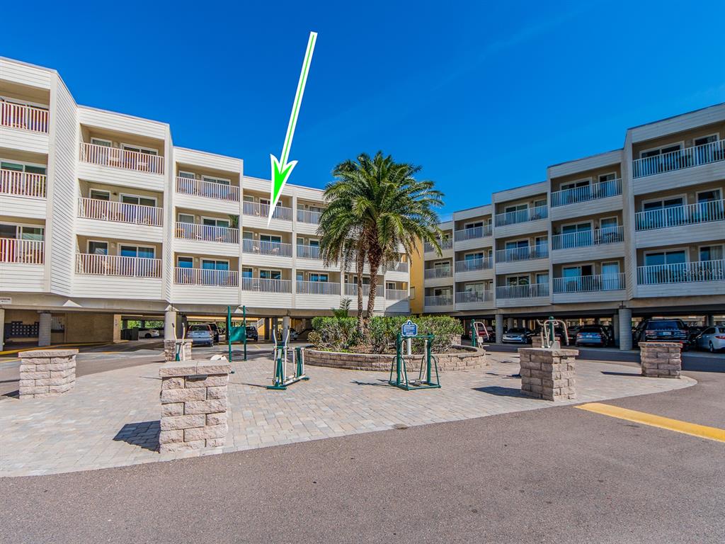 2506 North Rocky Point Drive, Unit 358 Tampa, FL 33607 - Photo 1 of 45 a building outdoor space with swimming pool and outdoor seating
