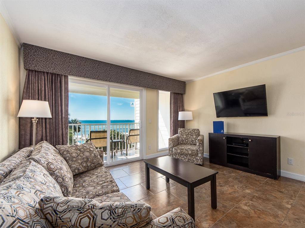 2506 North Rocky Point Drive, Unit 358 Tampa, FL 33607 - Photo 18 of 45 a living room with furniture and a flat screen tv