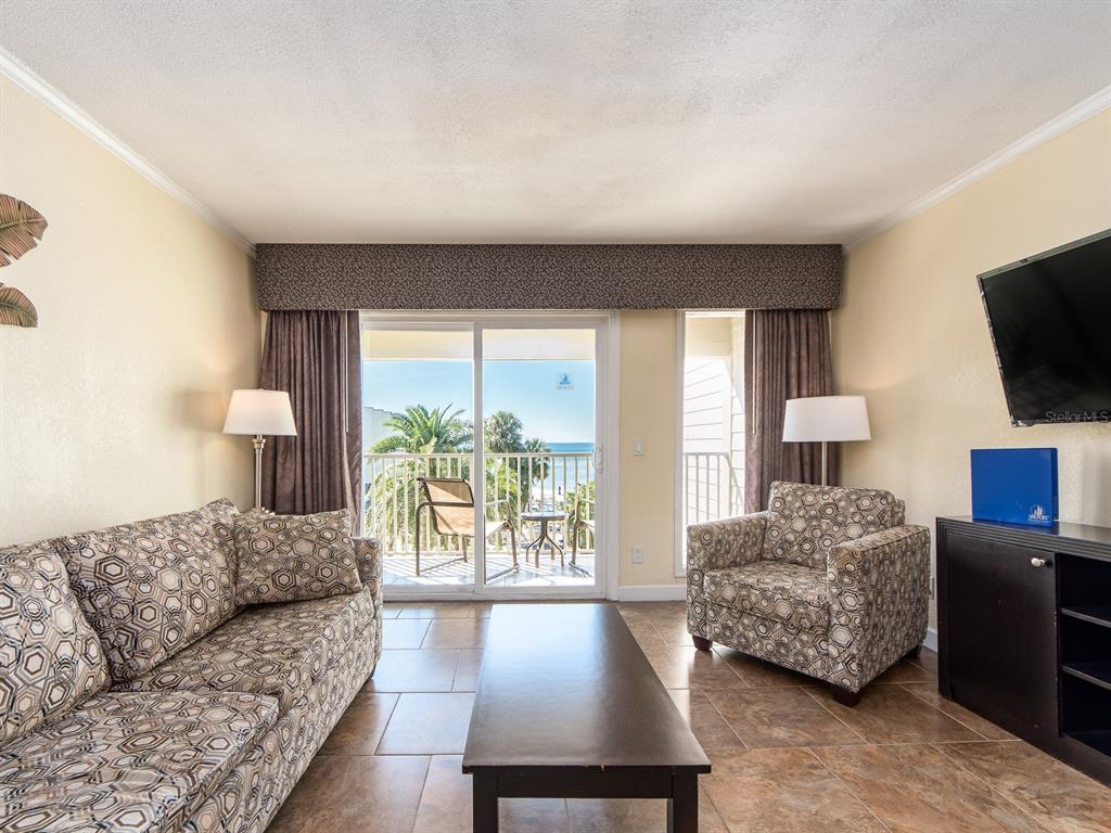 2506 North Rocky Point Drive, Unit 358 Tampa, FL 33607 - Photo 20 of 45 a living room with furniture and a flat screen tv