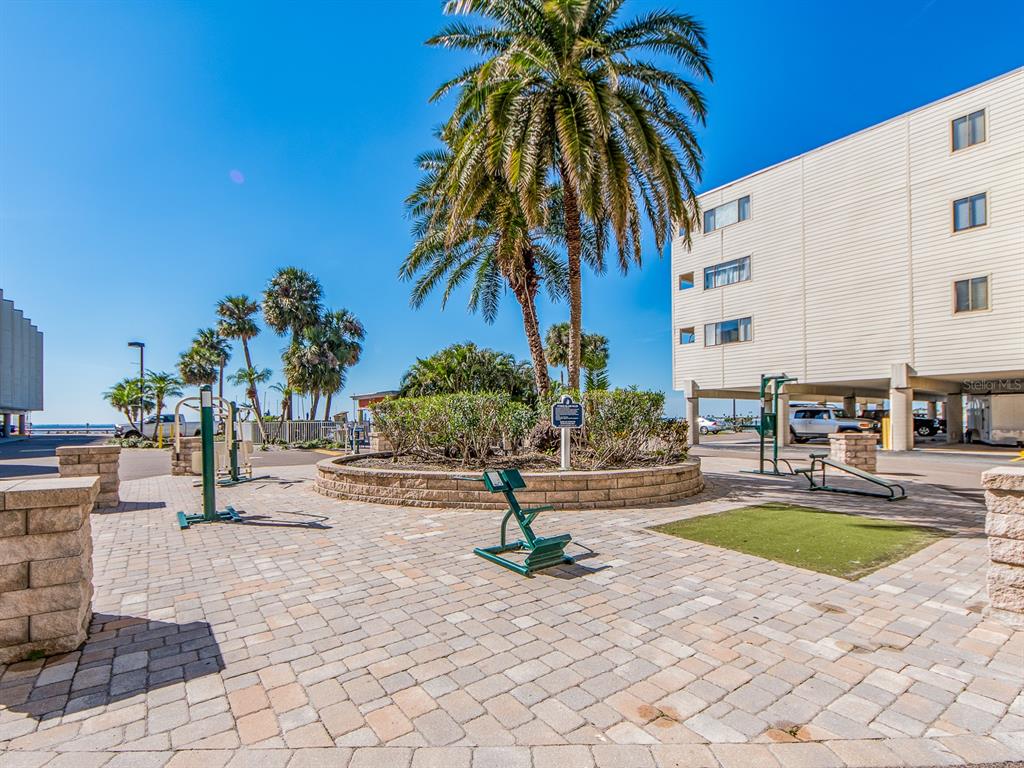 2506 North Rocky Point Drive, Unit 358 Tampa, FL 33607 - Photo 26 of 45 a view of a swimming pool with a lounge chair