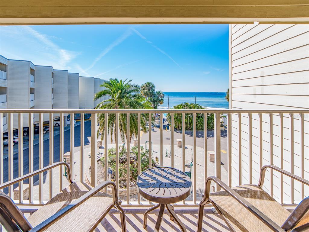 2506 North Rocky Point Drive, Unit 358 Tampa, FL 33607 - Photo 3 of 45 a view of balcony with wooden floor and outdoor seating