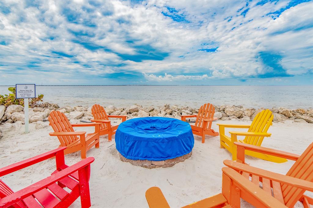 2506 North Rocky Point Drive, Unit 358 Tampa, FL 33607 - Photo 35 of 45 an aerial view of a house with a swimming pool and outdoor seating