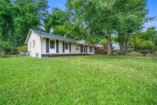 a view of a house with a big yard