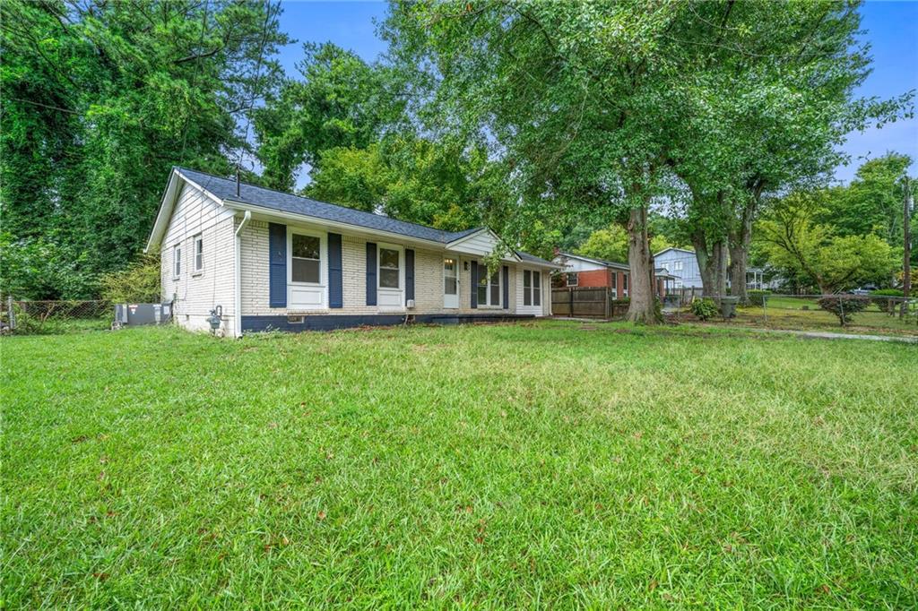 a view of a house with a big yard