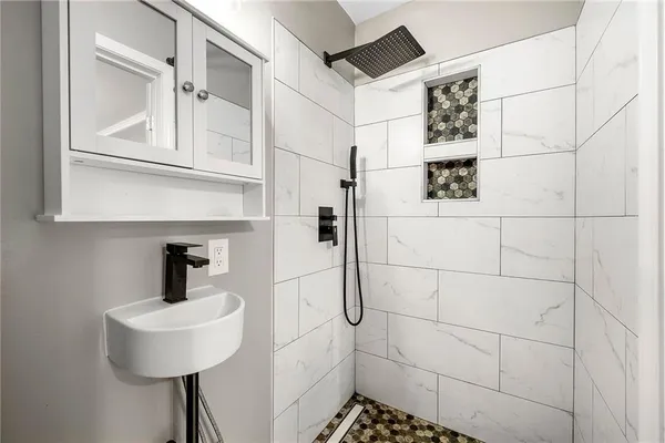 a bathroom with a sink and a mirror