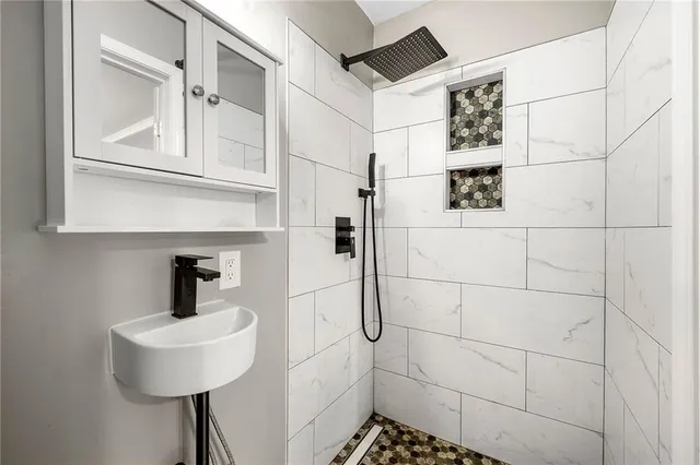 a bathroom with a sink and a mirror