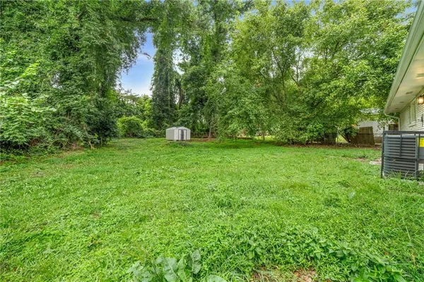 a backyard of a house with lots of green space