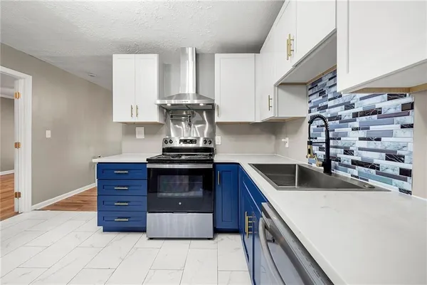 a kitchen with a sink and cabinets