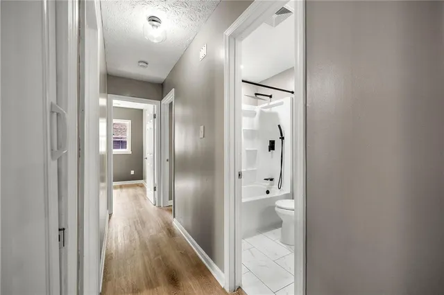 a bathroom with a glass door shower
