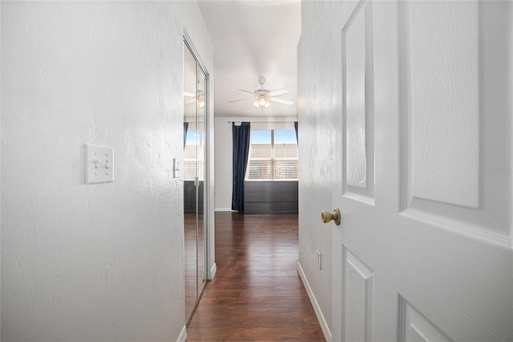 3910 Southwest 20th Avenue, Unit 1403 Gainesville, FL 32607 - Photo 28 of 36 a view of a hallway with wooden floor