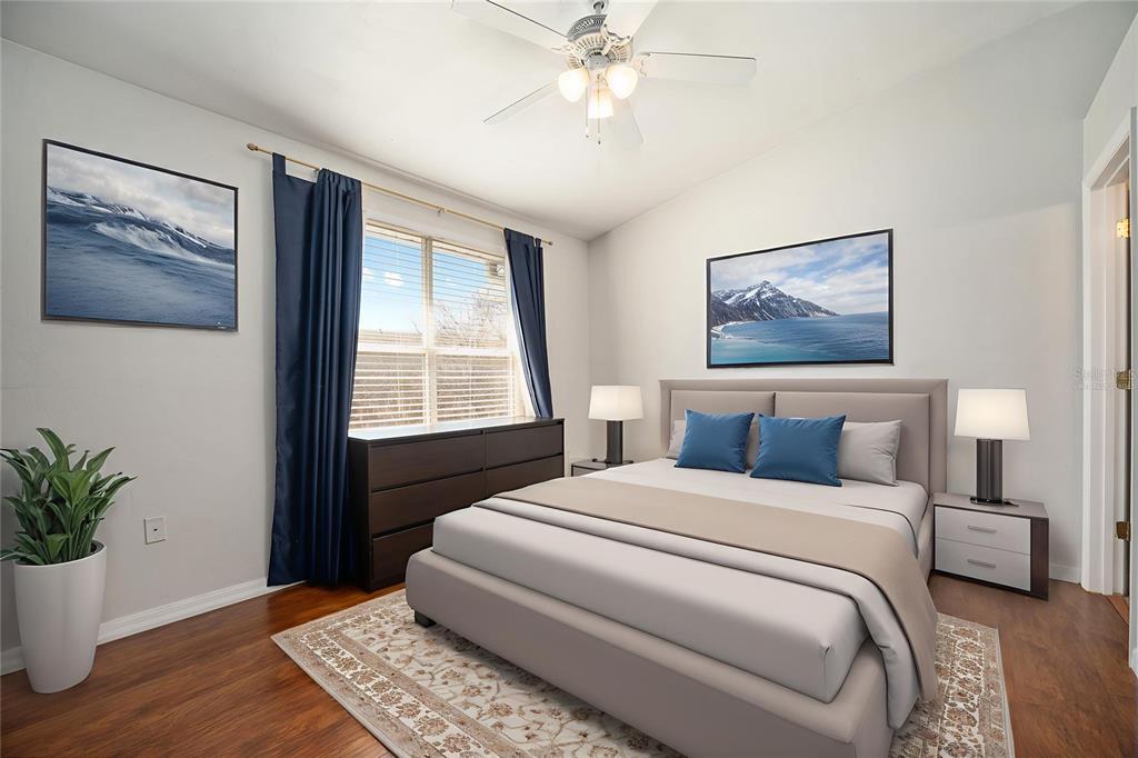 3910 Southwest 20th Avenue, Unit 1403 Gainesville, FL 32607 - Photo 30 of 36 a bedroom with a large bed and a window