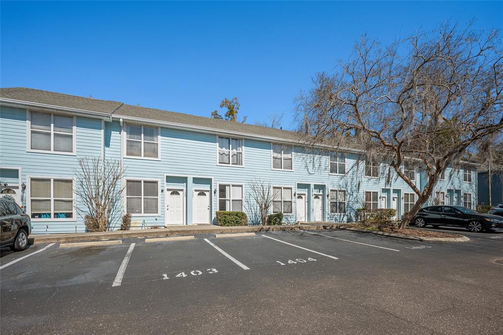 3910 Southwest 20th Avenue, Unit 1403 Gainesville, FL 32607 - Photo 4 of 36 a view of a street with a building in the background