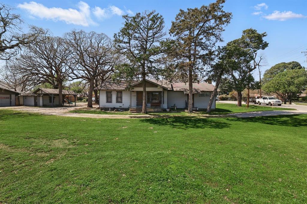 1509 Tinker Road Colleyville, TX 76034 - Photo 12 of 18 a view of a house with a big yard
