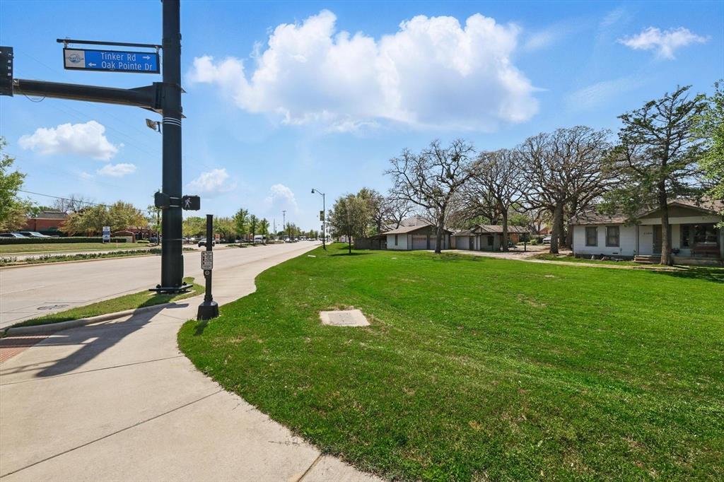1509 Tinker Road Colleyville, TX 76034 - Photo 10 of 18 a view of a street with a yard