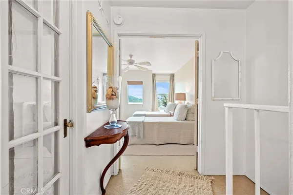a very nice looking room with a large window and chandelier