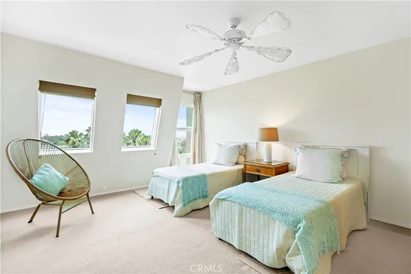 a bedroom with double bed and a window