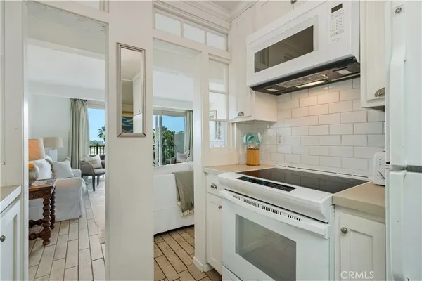 a kitchen with a stove and a microwave
