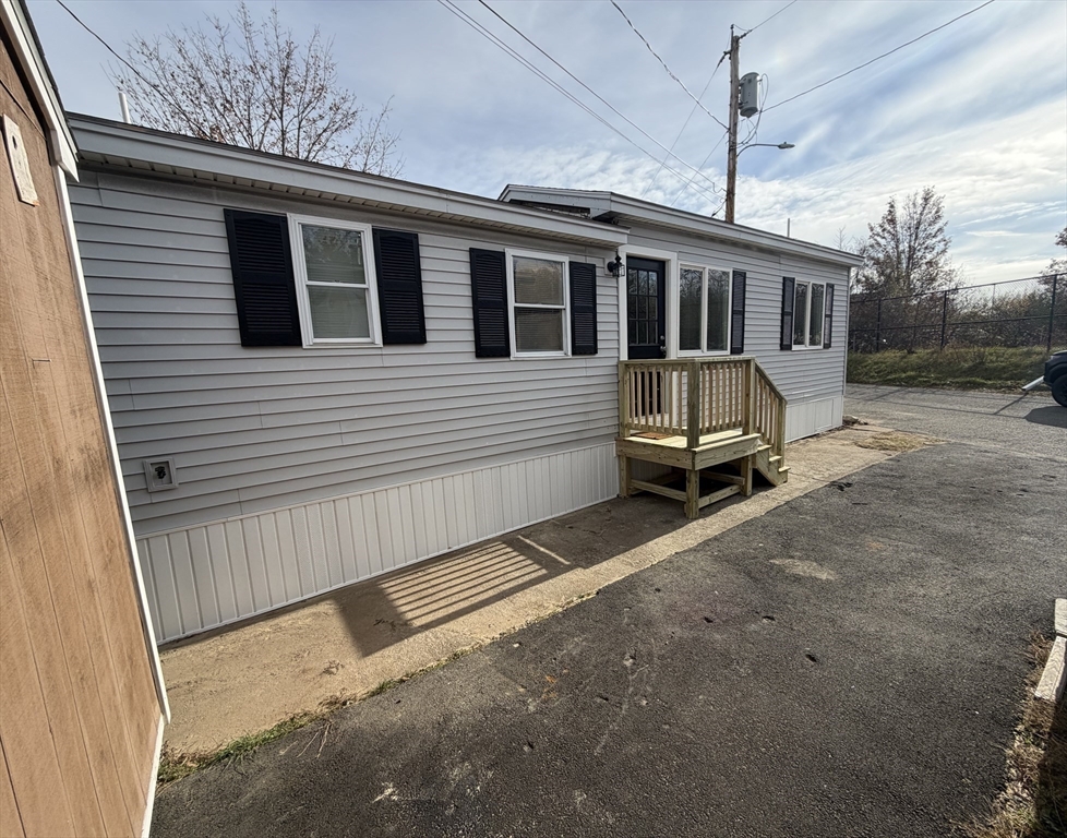 200 North Street, Unit 31A Danvers, MA 01923 - Photo 17 of 20 a view of a house with a wooden fence
