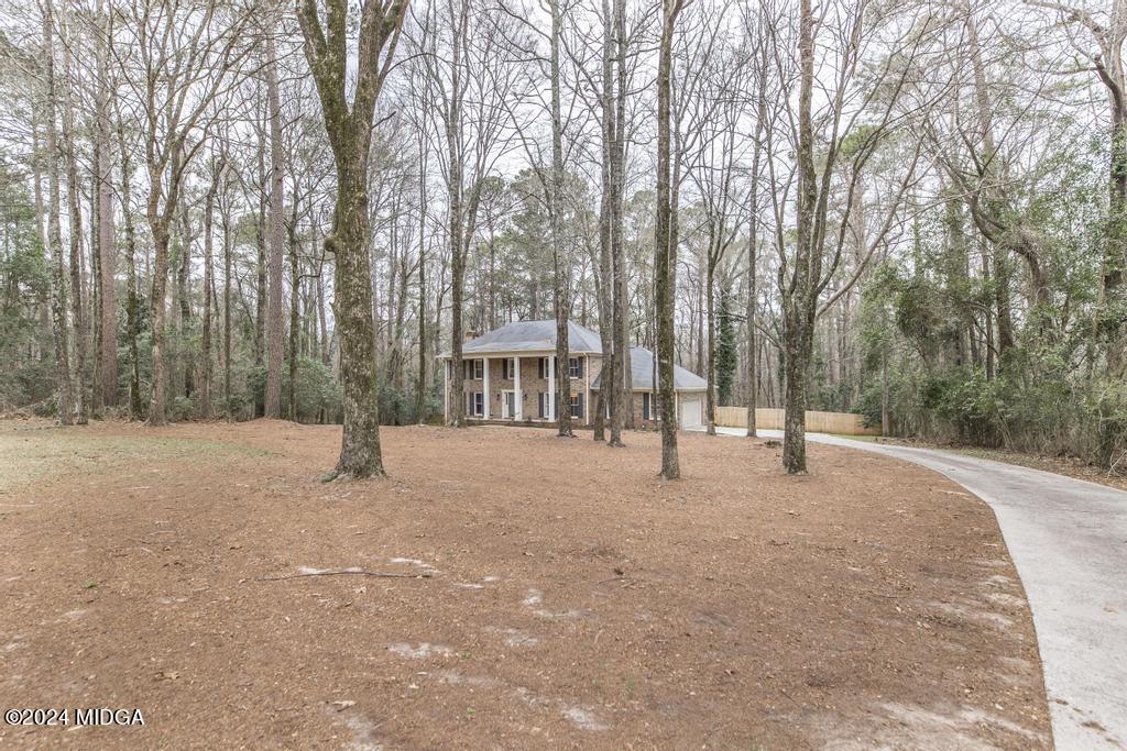 1226 Bass Road Macon, GA 31210 - Photo 15 of 48 a house with trees in front of it