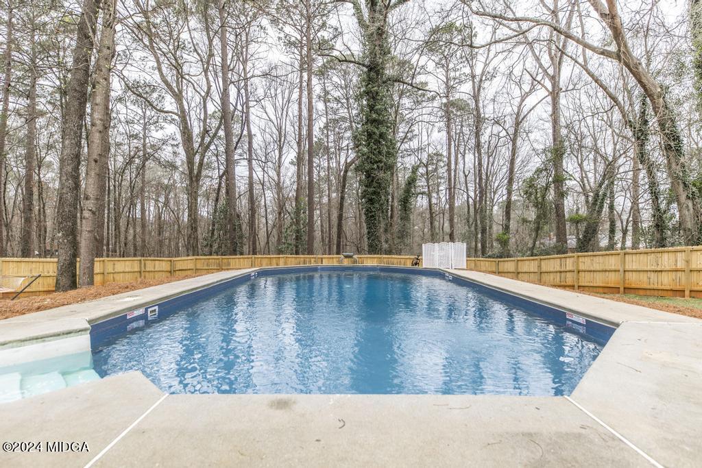 1226 Bass Road Macon, GA 31210 - Photo 46 of 48 a view of outdoor space with swimming pool and trees