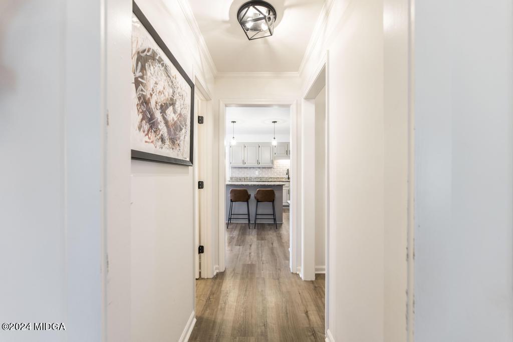 1226 Bass Road Macon, GA 31210 - Photo 8 of 48 a view of a hallway with wooden floor and a hallway