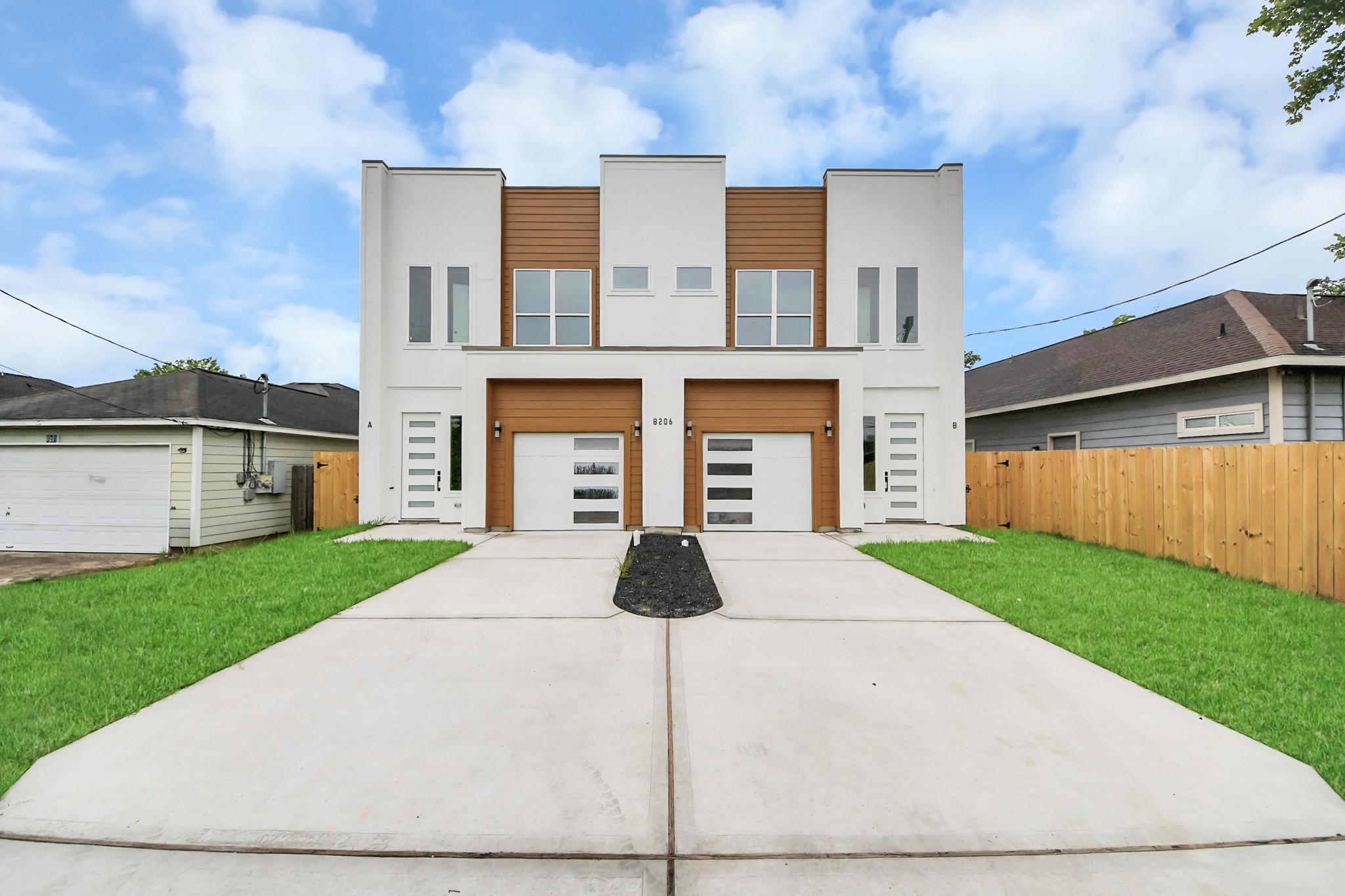 a front view of a house with yard