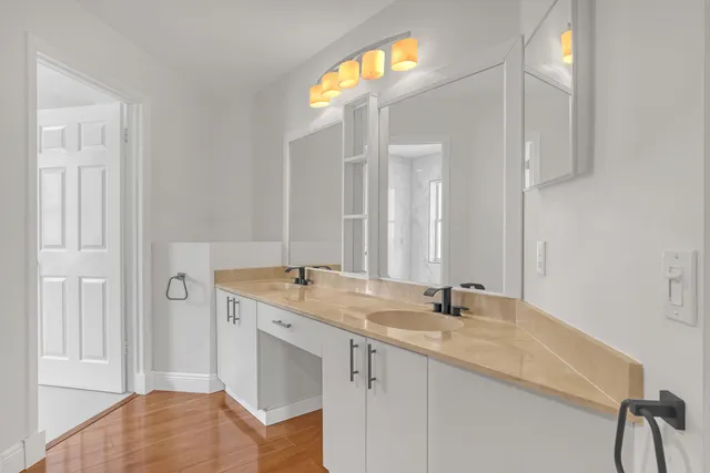 a white toilet sitting next to a window