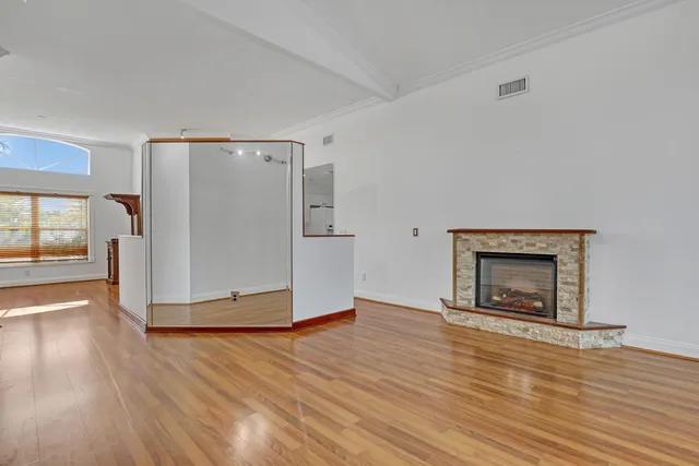 a view of a livingroom with wooden floor