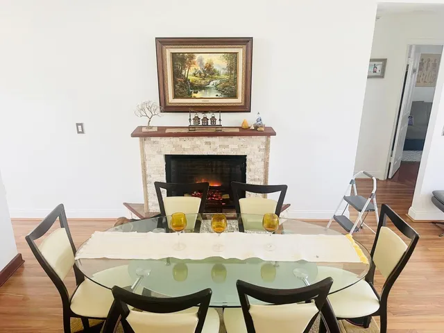 a dining room with furniture and a fireplace