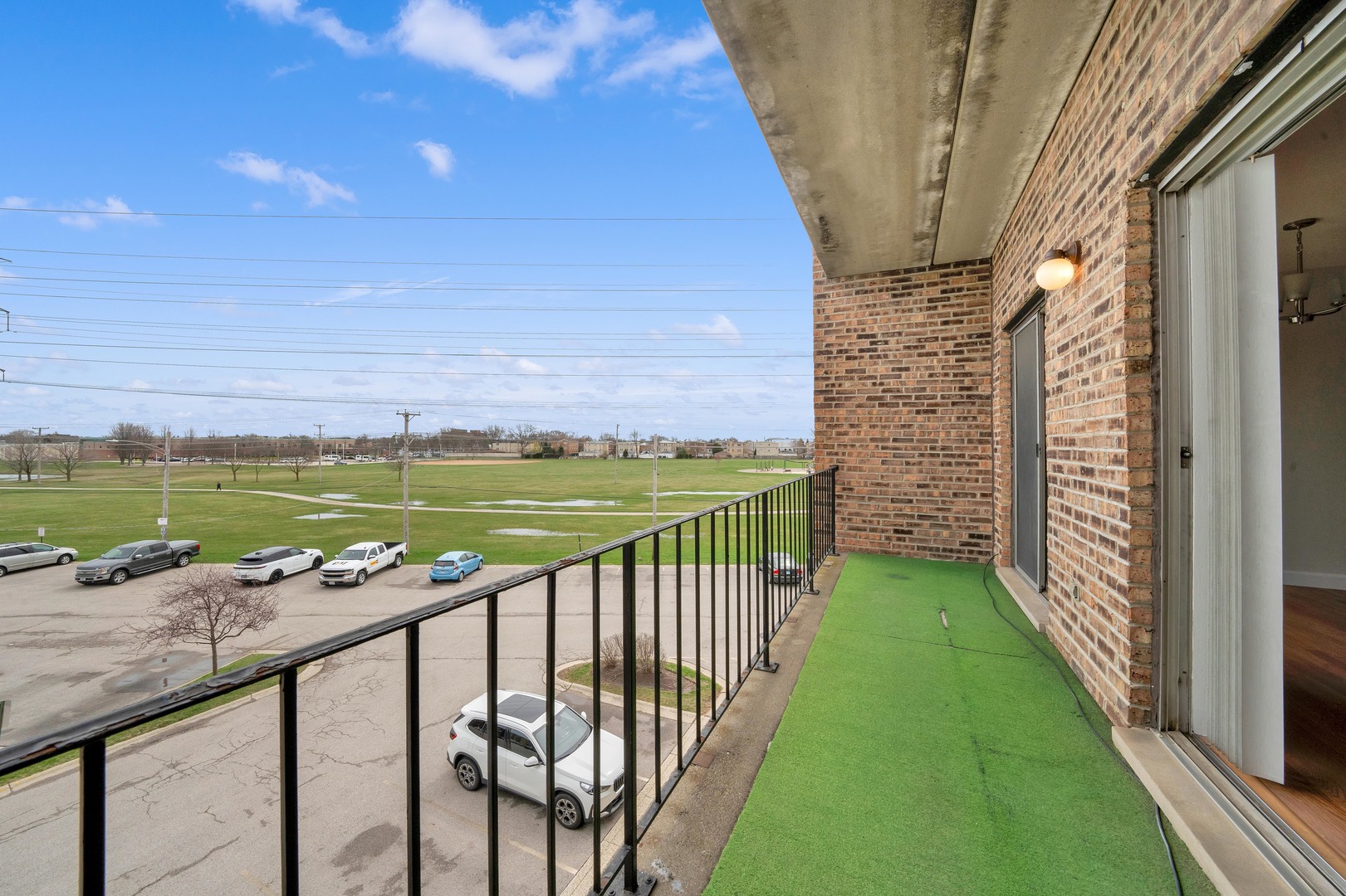 725 West Huntington Commons Road, Unit 314 Mount Prospect, IL 60056 - Photo 20 of 24 a view of a ocean from a balcony