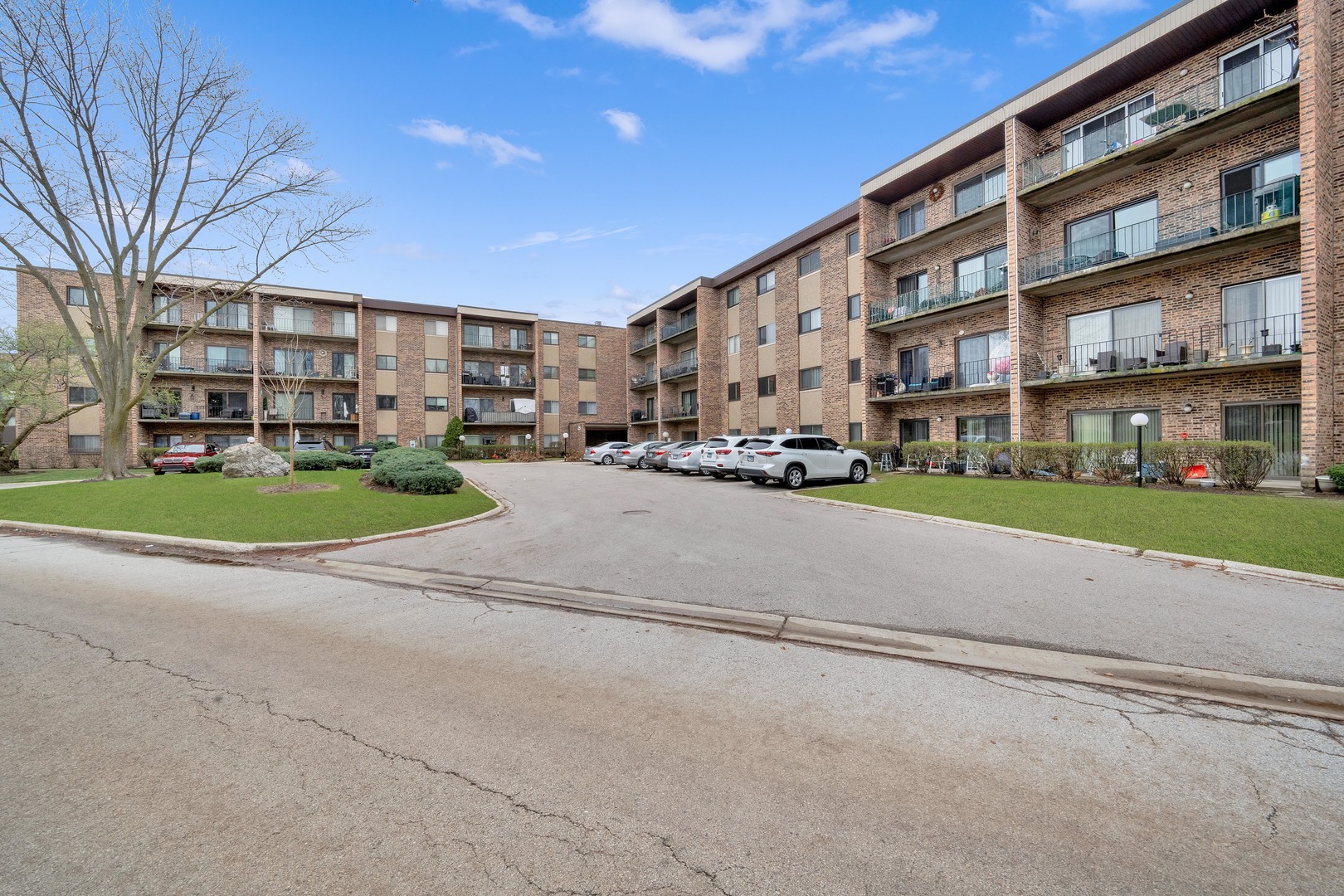 725 West Huntington Commons Road, Unit 314 Mount Prospect, IL 60056 - Photo 3 of 24 a city view with tall buildings and a yard
