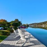 a view of a lake with couches in the patio