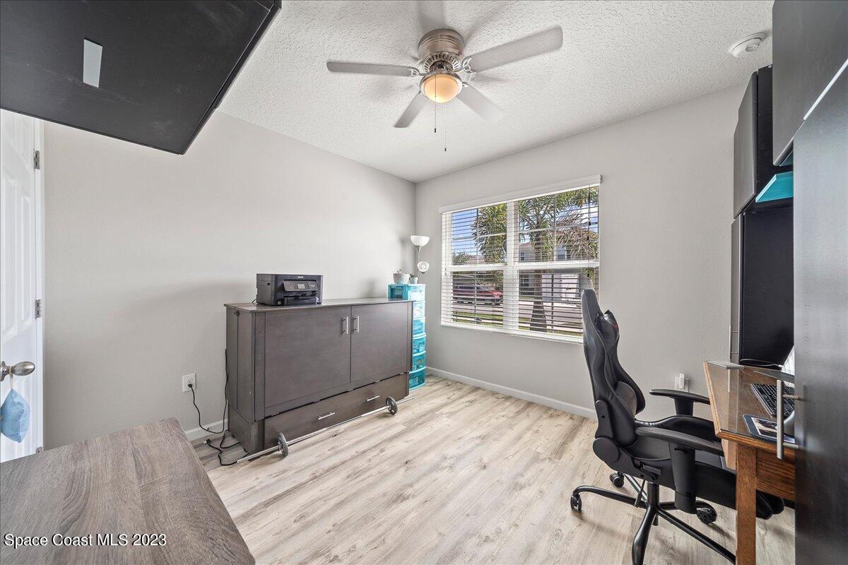 4480 Pagosa Springs Circle Melbourne, FL 32901 - Photo 14 of 41 a view of a workspace with furniture and a window