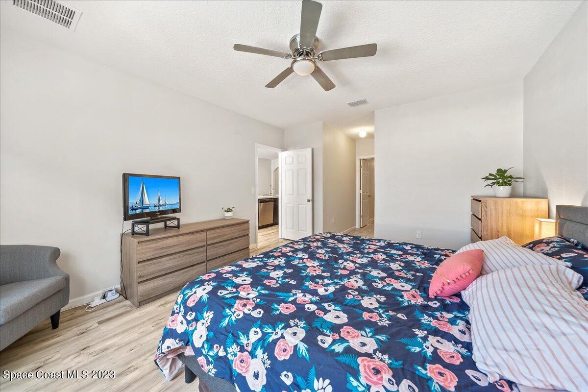 4480 Pagosa Springs Circle Melbourne, FL 32901 - Photo 18 of 41 a bedroom with a bed and a couch