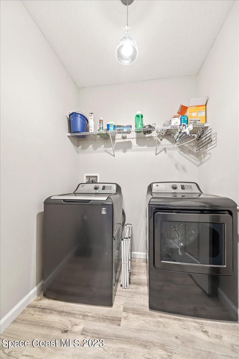 4480 Pagosa Springs Circle Melbourne, FL 32901 - Photo 22 of 41 a utility room with two washing machine and a sink