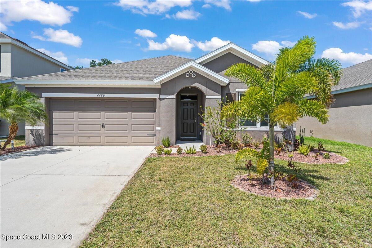 4480 Pagosa Springs Circle Melbourne, FL 32901 - Photo 32 of 41 a front view of a house with a garden