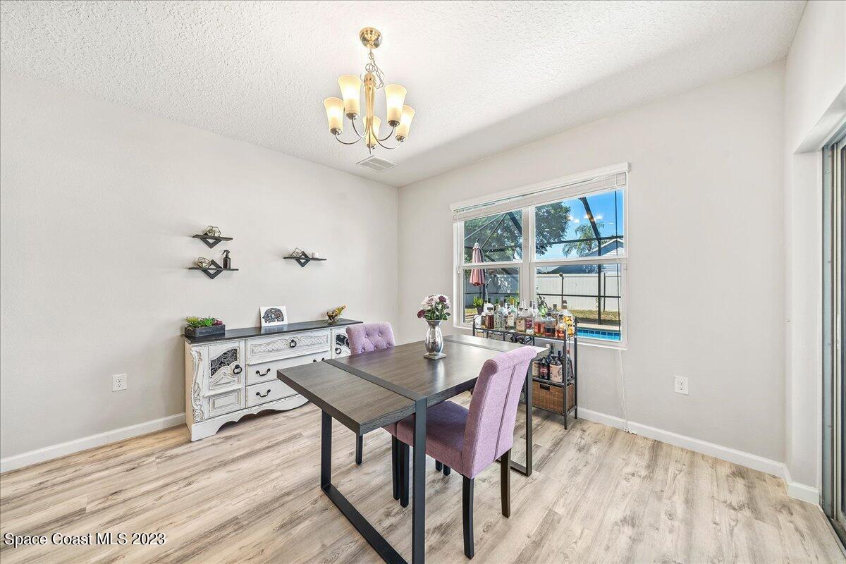 4480 Pagosa Springs Circle Melbourne, FL 32901 - Photo 9 of 41 a view of a dining room with furniture window and outside view